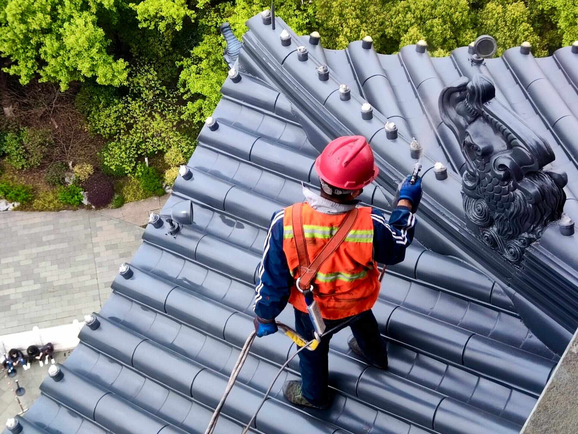 worker-on-roof Commercial roofer handling a preventative maintenance on a building in Atlanta