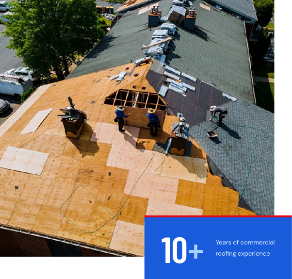 Roofing professionals replacing a roof deck