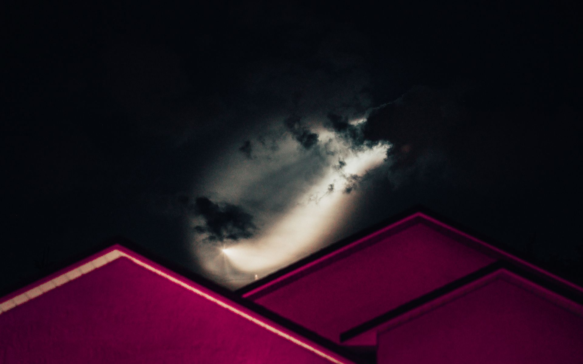 Storm clouds over a commercial roofing system in Atlanta