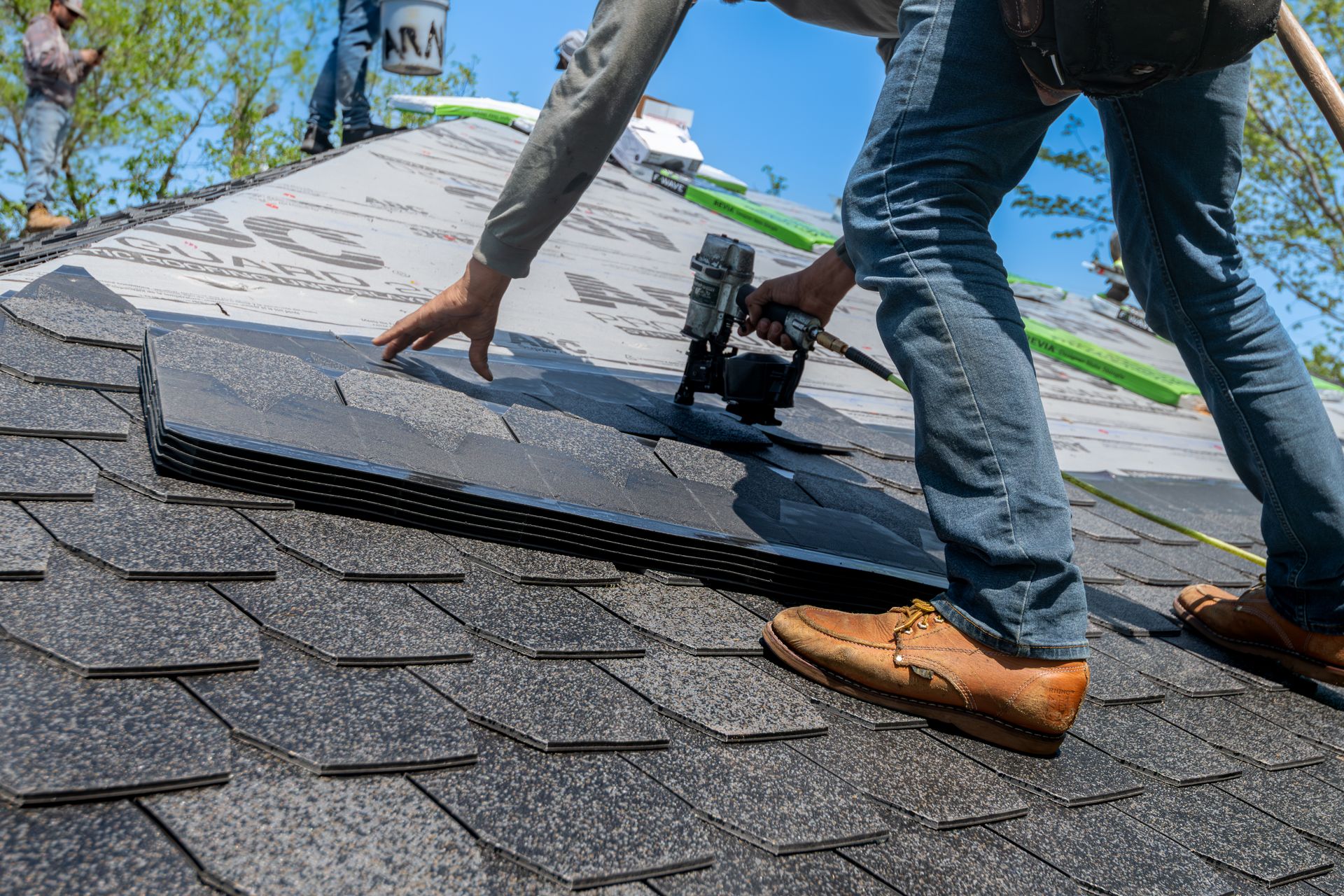 A roofer handling a commercial roofing job in Atlanta